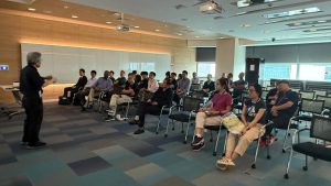 Dr Yohei Otoki conducting a seminar at NSTIC (GaN) on gallium nitride semiconductor materials and power device innovations