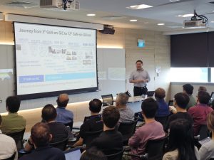 Dr Han Wui Then presenting his seminar on 300mm GaN-on-Si technology to researchers and attendees at NSTIC (GaN).