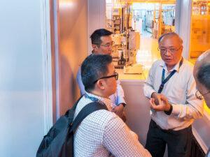 Prof Ng explaining semiconductor development process to visiting MINDEF FSTD representatives in Singapore.