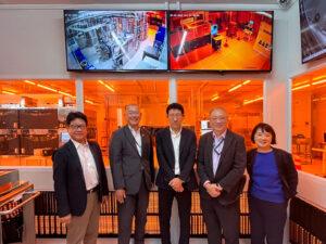 Group photo of NTT-AT and NSTIC (GaN) teams at Singapore’s Gallium Nitride research facility cleanroom.